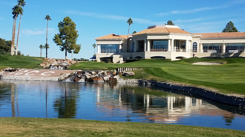 Panoramic view of a lush green golf course at Canyon Gate Country Club. Smooth