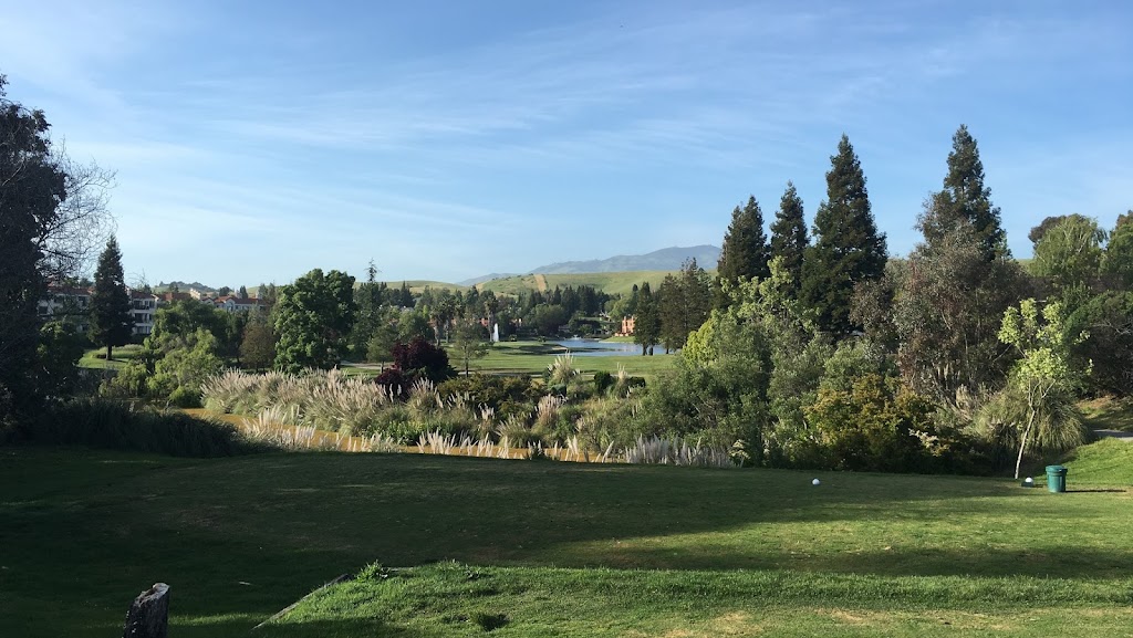 Panoramic view of a lush green golf course at Canyon Lakes Golf Course. Smooth