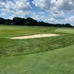 Panoramic view of a lush green golf course at Cape Arundel Golf Club. Smooth