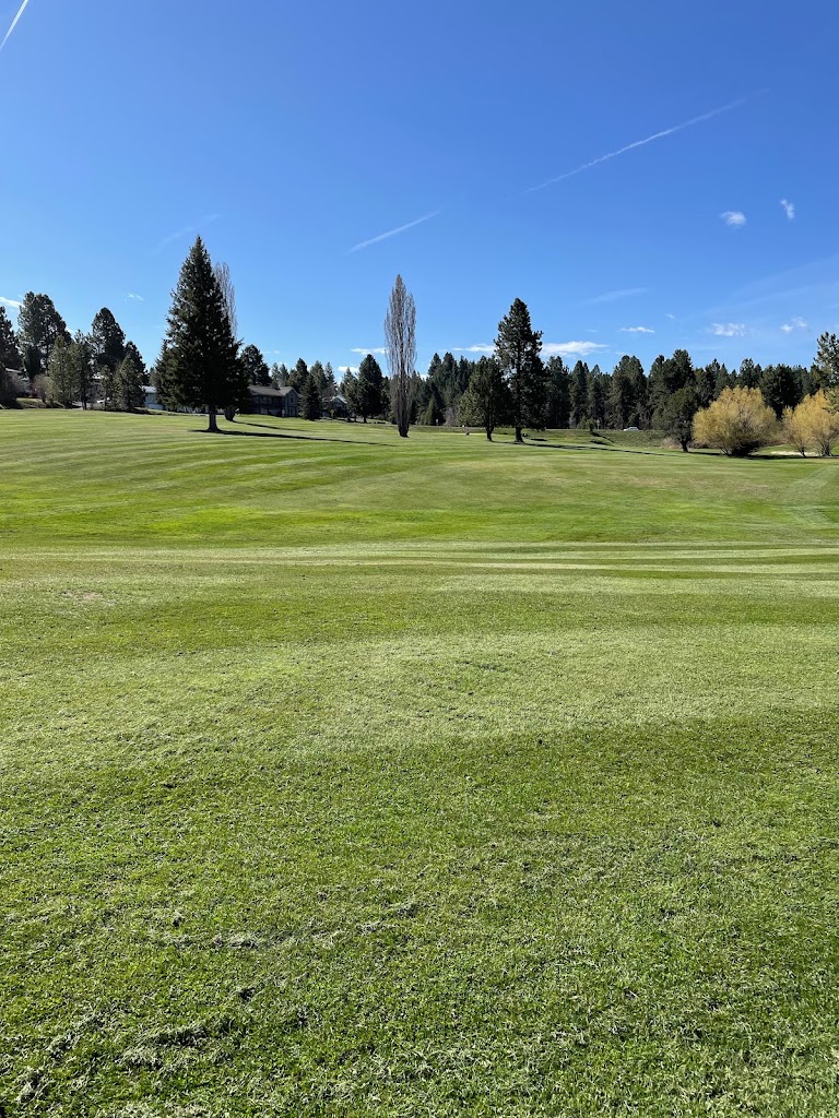 Panoramic view of a lush green golf course at Cascade Golf Course. Smooth