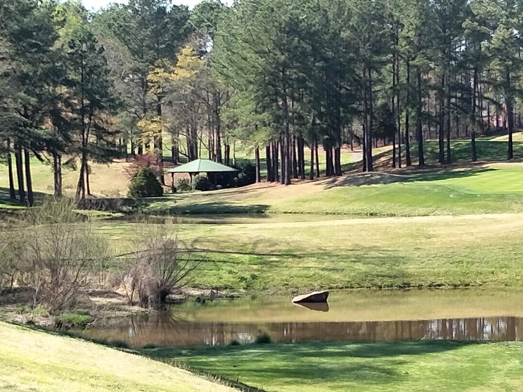 Panoramic view of a lush green golf course at Caswell Pines Golf Club. Smooth