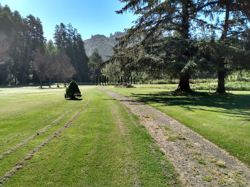 Panoramic view of a lush green golf course at Cedar Bend Golf Course. Smooth