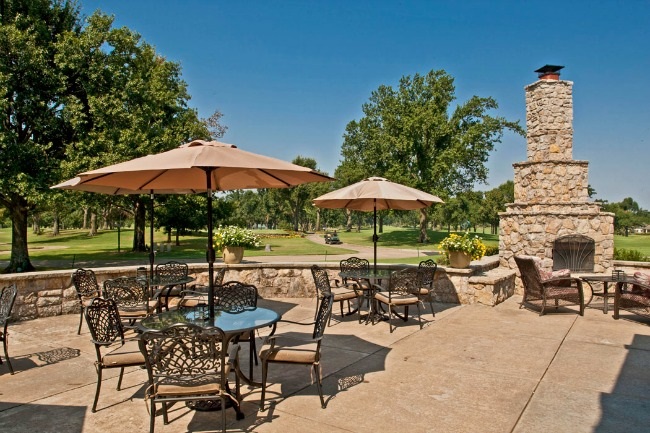 Panoramic view of a lush green golf course at Cedar Ridge Country Club. Smooth