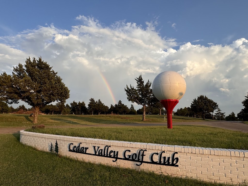 Panoramic view of a lush green golf course at Cedar Valley Golf Club. Smooth