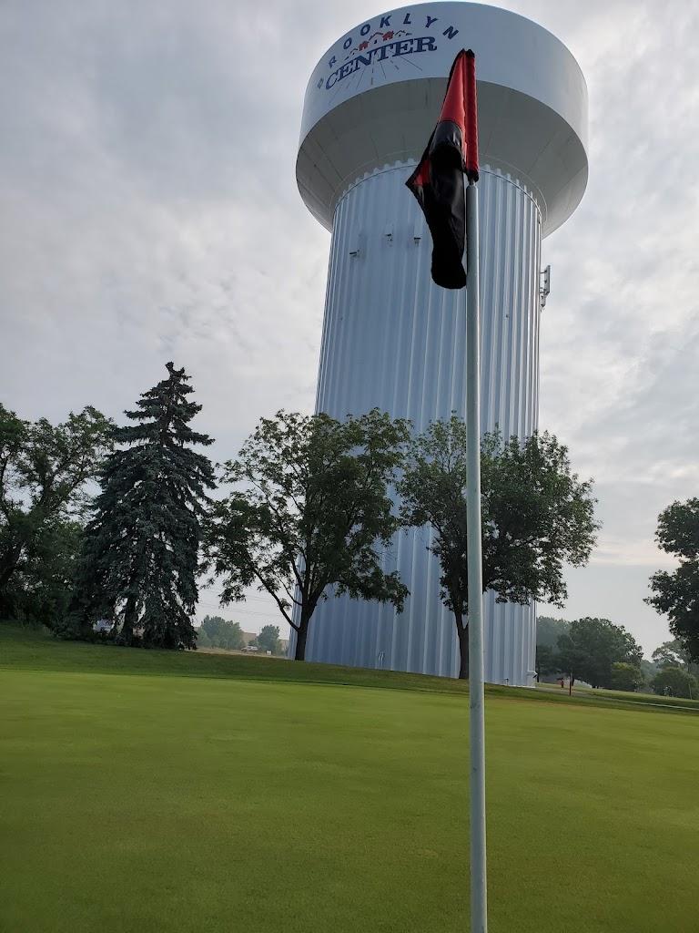 Panoramic view of a lush green golf course at Centerbrook Golf Course. Smooth