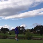 Panoramic view of a lush green golf course at Champlain Country Club. Smooth