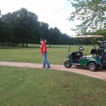 green grass with the flag in the hole.