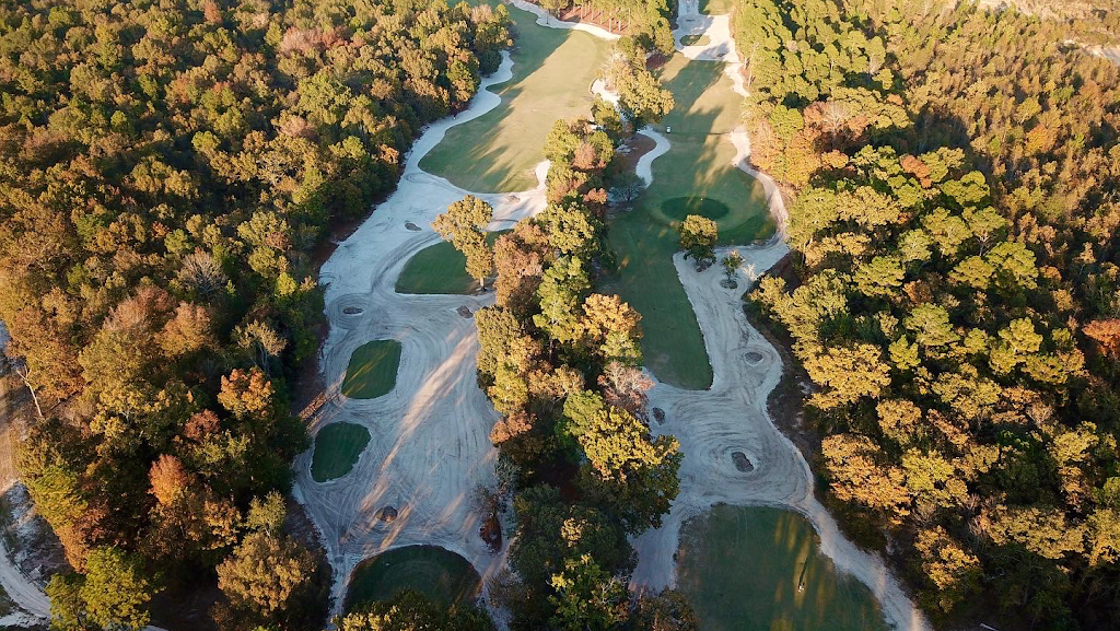 Panoramic view of a lush green golf course at Charwood Golf Club. Smooth