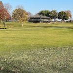 Panoramic view of a lush green golf course at Chaska Golf Course. Smooth