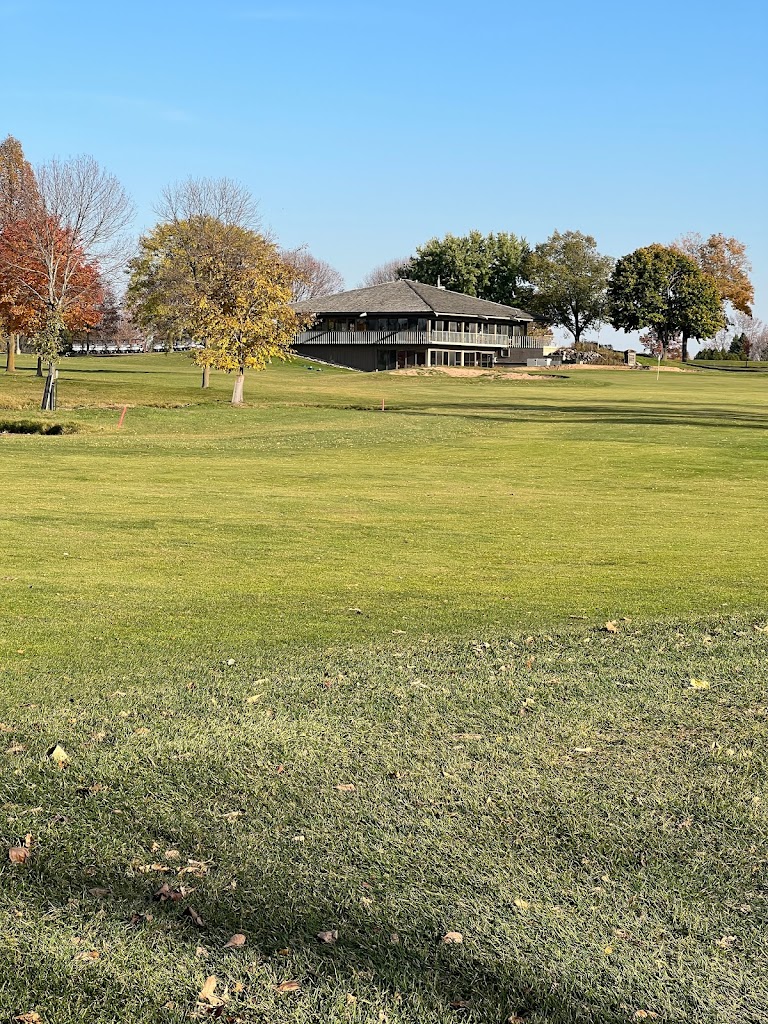 Panoramic view of a lush green golf course at Chaska Golf Course. Smooth