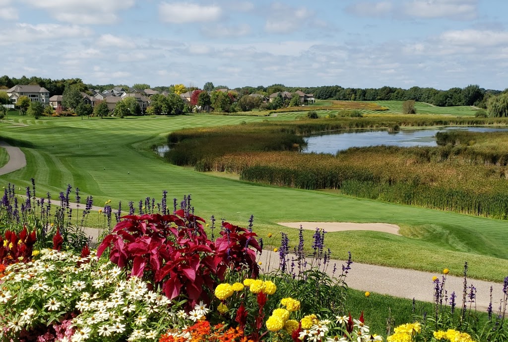 Panoramic view of a lush green golf course at Chaska Town Course. Smooth