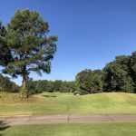 Panoramic view of a lush green golf course at Chenal Country Club. Smooth