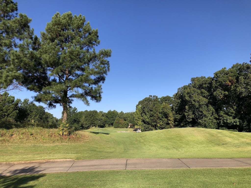 Panoramic view of a lush green golf course at Chenal Country Club. Smooth