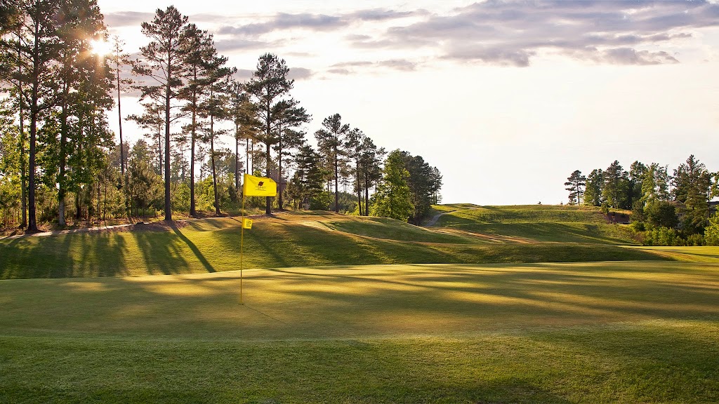 Panoramic view of a lush green golf course at Cherokee Valley Course and Club. Smooth