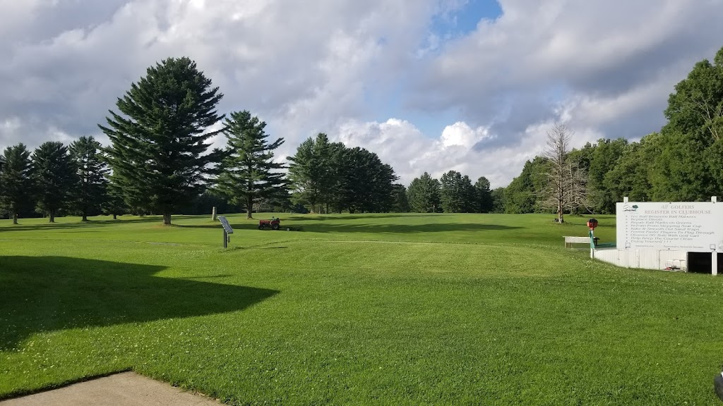 Panoramic view of a lush green golf course at Cherry Hill Country Club. Smooth