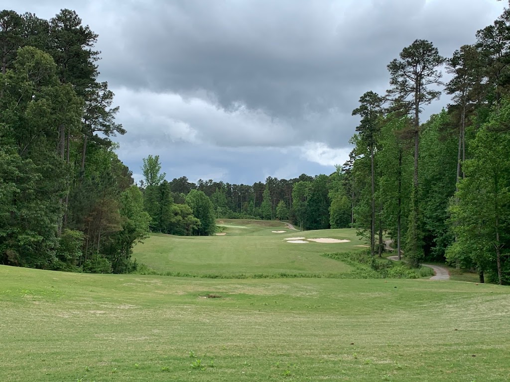 Panoramic view of a lush green golf course at Chickasaw Golf. Smooth