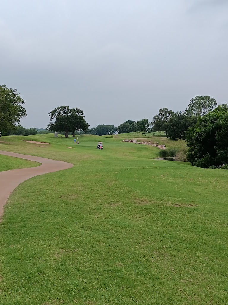 Panoramic view of a lush green golf course at Chickasaw Pointe Golf Club. Smooth