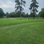 Panoramic view of a lush green golf course at City Park Golf Course. Smooth