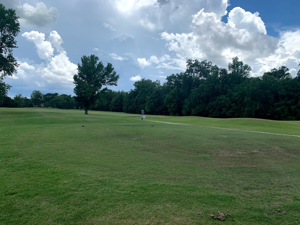 Panoramic view of a lush green golf course at Clark Park Golf Course. Smooth