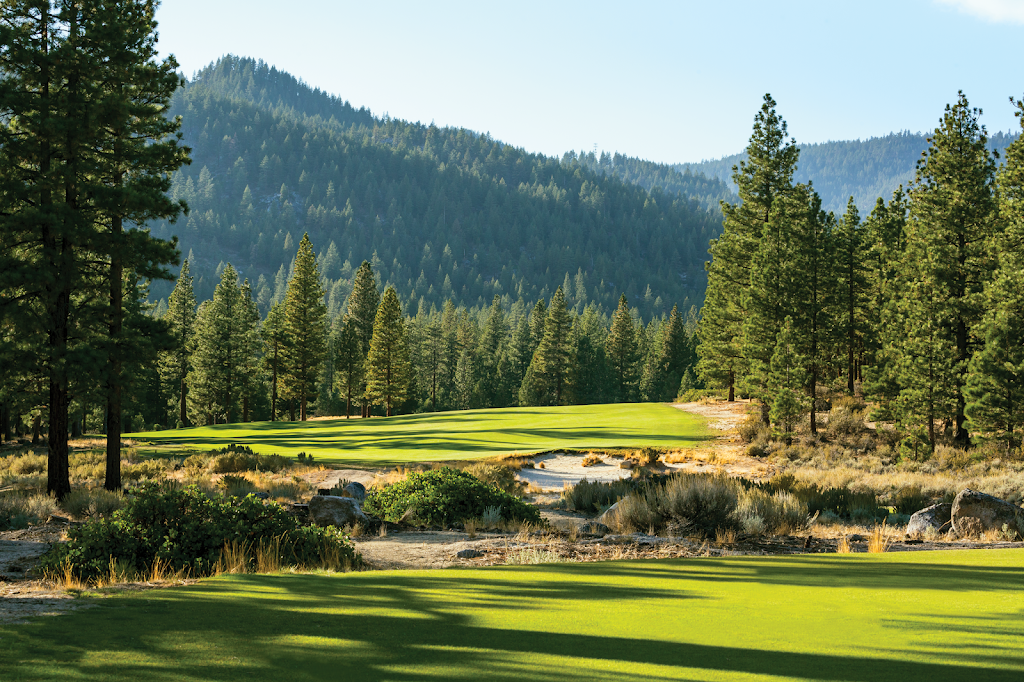 Panoramic view of a lush green golf course at Clear Creek Tahoe. Smooth