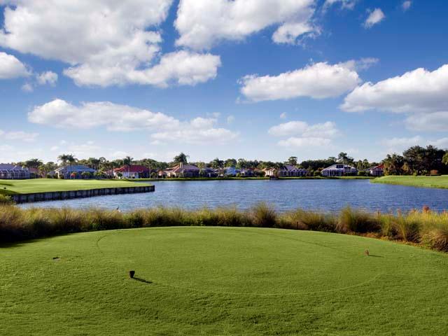 Panoramic view of a lush green golf course at Club Renaissance. Smooth