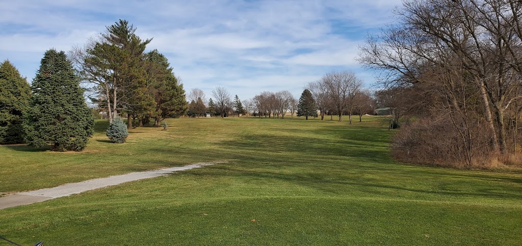 Panoramic view of a lush green golf course at College Heights Country Club. Smooth