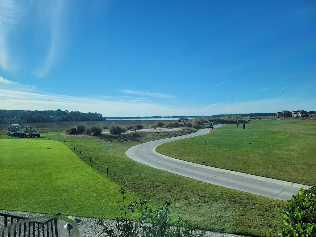 Panoramic view of a lush green golf course at Colleton River Club. Smooth