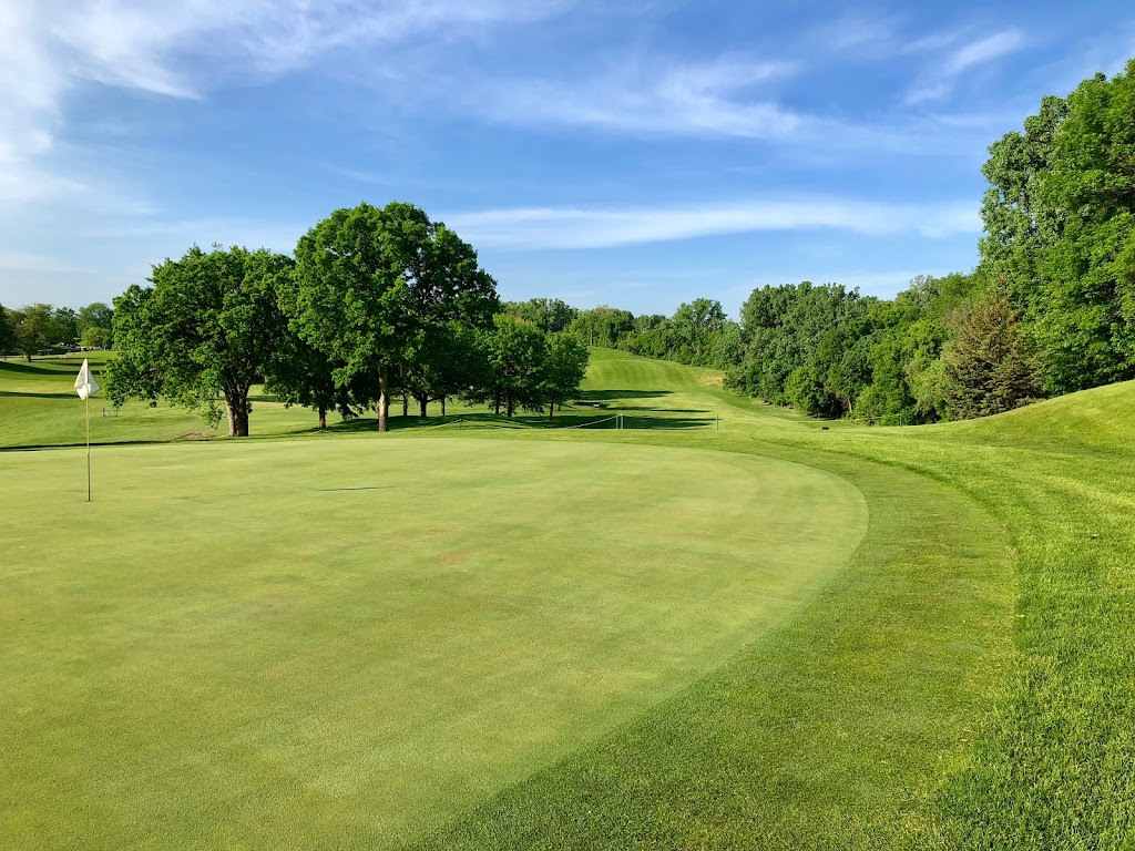 Panoramic view of a lush green golf course at Columbia Golf Club. Smooth