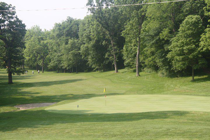 Panoramic view of a lush green golf course at Copper Creek Golf Club and Event Center. Smooth