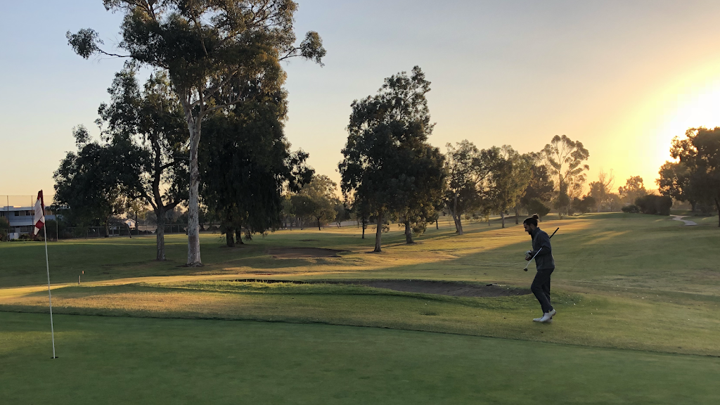 Panoramic view of a lush green golf course at Costa Mesa Country Club. Smooth