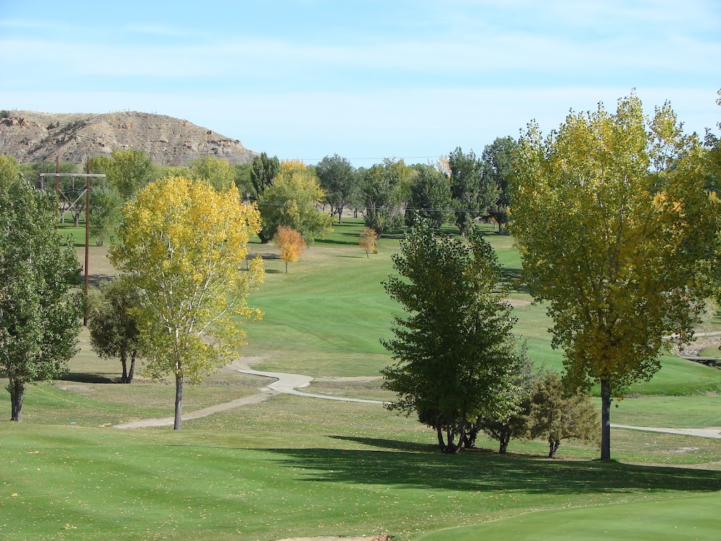 Panoramic view of a lush green golf course at Cottonwood Country Club. Smooth