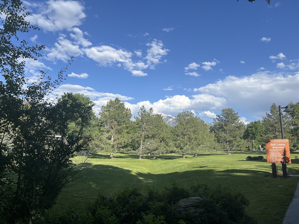 Panoramic view of a lush green golf course at Cottonwood Country Club. Smooth