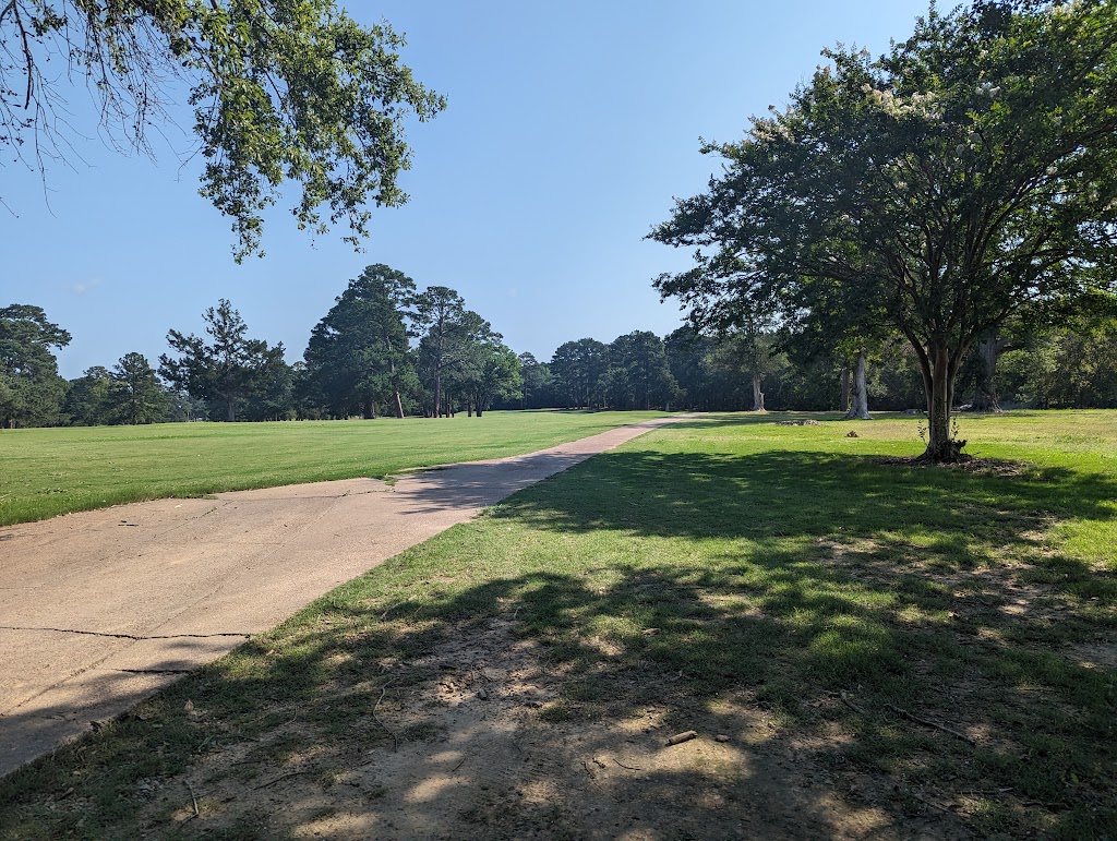 Panoramic view of a lush green golf course at Country Club of Canton. Smooth