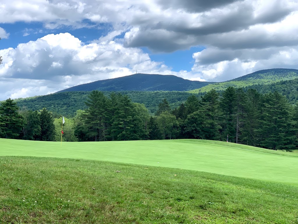 Panoramic view of a lush green golf course at Country Club of New Hampshire. Smooth