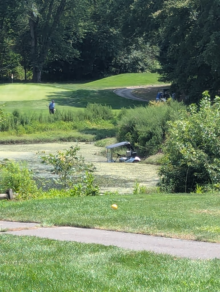 Panoramic view of a lush green golf course at Cranbury Golf Club. Smooth