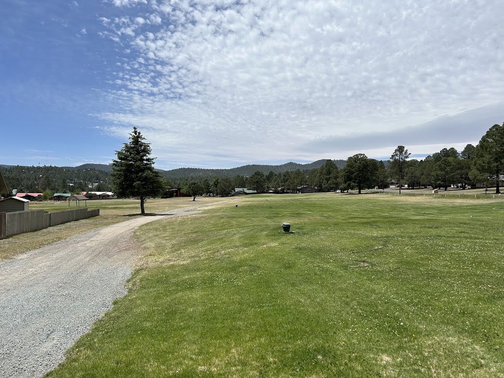 Panoramic view of a lush green golf course at Cree Meadows Public Golf Course. Smooth