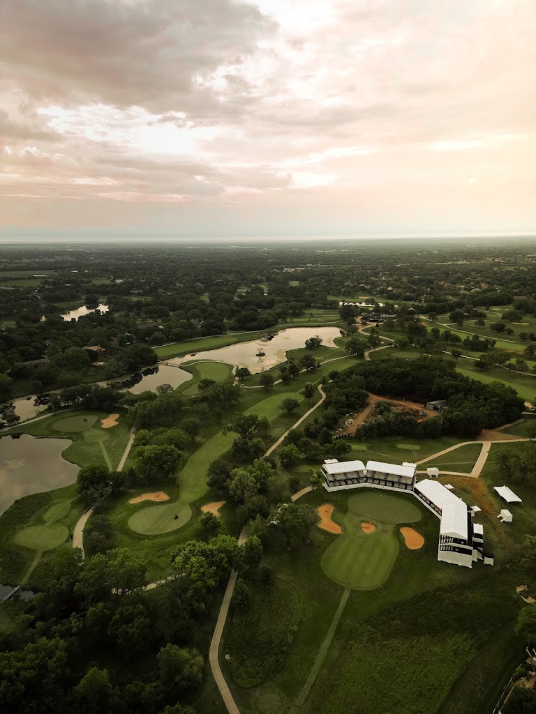 Panoramic view of a lush green golf course at Crestview Country Club. Smooth