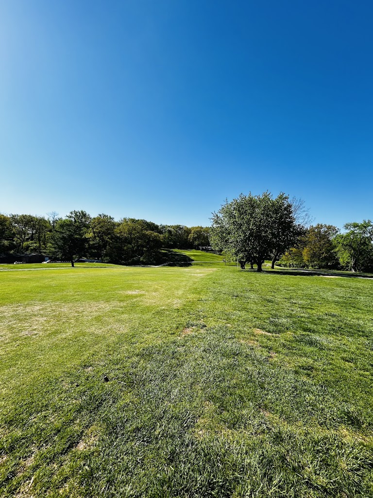 Panoramic view of a lush green golf course at Creve Coeur Golf Course. Smooth