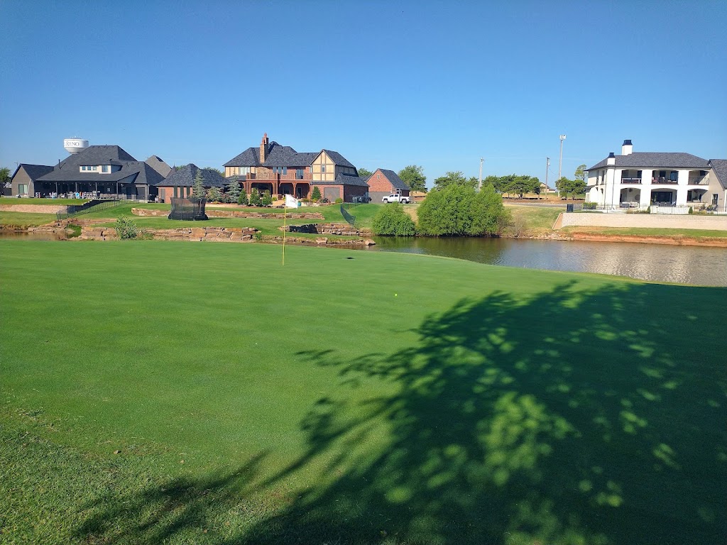 Panoramic view of a lush green golf course at Crimson Creek Golf Course. Smooth