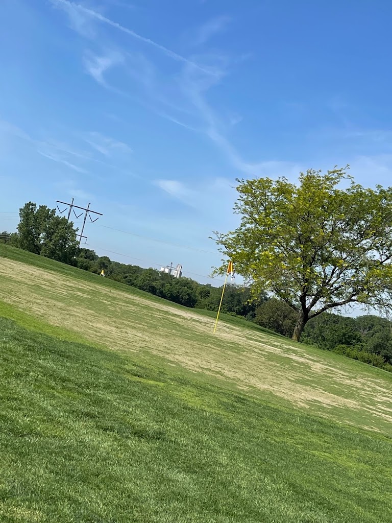 Panoramic view of a lush green golf course at Crooked Creek Golf Club. Smooth