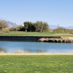 Panoramic view of a lush green golf course at Crooked Tree Golf Course. Smooth