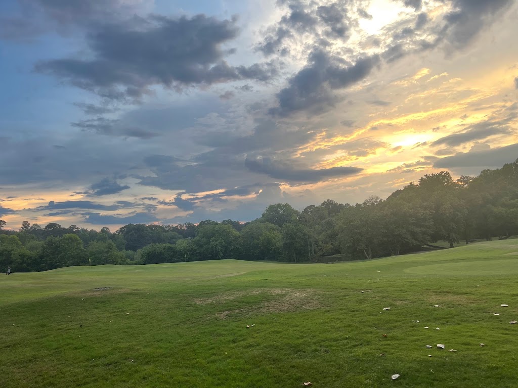 Panoramic view of a lush green golf course at Cross Creek Golf Club. Smooth