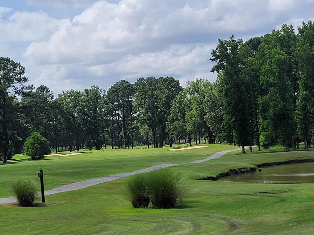 Panoramic view of a lush green golf course at Crosswinds Golf Club. Smooth