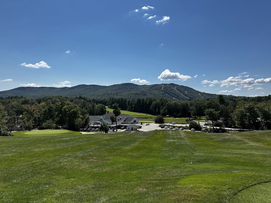 Panoramic view of a lush green golf course at Crotched Mountain Golf Club. Smooth