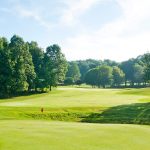 Panoramic view of a lush green golf course at Crumpin-Fox Club : 18 Hole Golf Course Bernardston