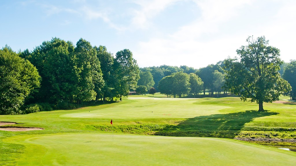 Panoramic view of a lush green golf course at Crumpin-Fox Club : 18 Hole Golf Course Bernardston