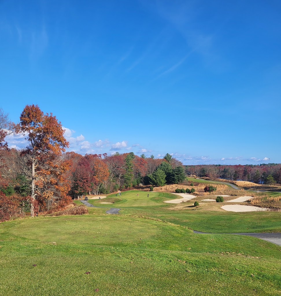 Panoramic view of a lush green golf course at Crystal Lake Golf Club. Smooth