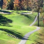 Panoramic view of a lush green golf course at Cumberland Lake Golf and Lodge. Smooth