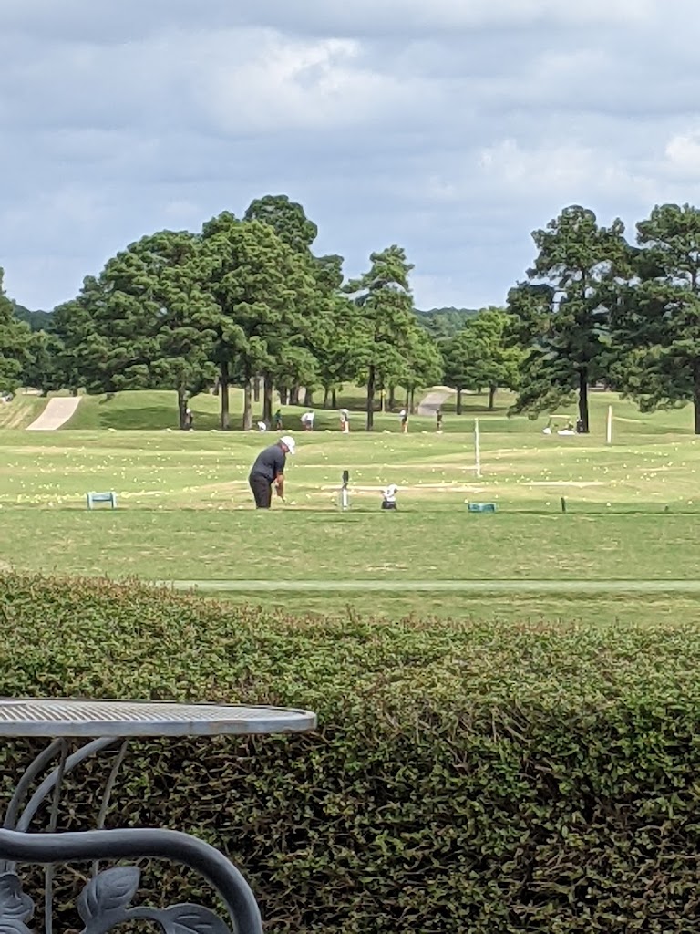 Panoramic view of a lush green golf course at Cypress Lakes Golf Course. Smooth