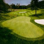 Panoramic view of a lush green golf course at Darkhorse Golf Course. Smooth